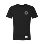 This image features the "Dopamine Tee," a sleek black t-shirt with a distinctive graphic design. The front of the shirt displays a subtle, intricate pattern centered around a circular motif, which adds a touch of unique detail to the otherwise simple design.